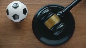 Law and soccer sport.Football coach accused. Concussion lawsuit.