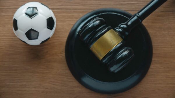 Law and soccer sport.Football coach accused. Concussion lawsuit.